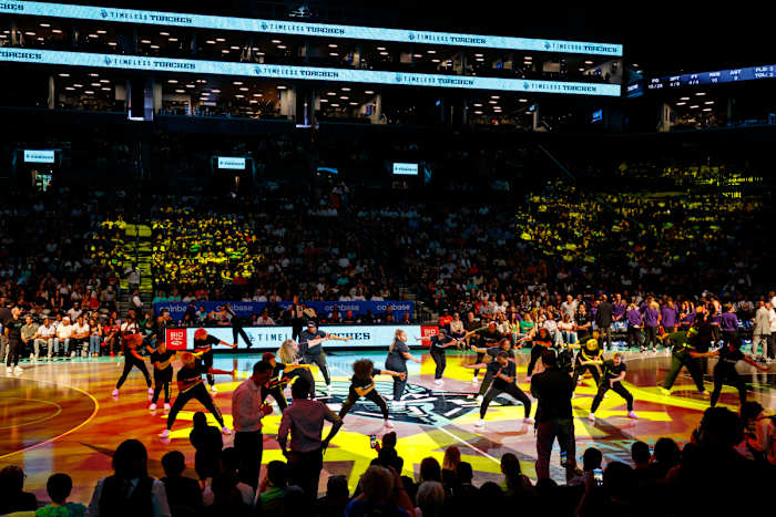 A shot from the crowd as the New York Liberty's dance squad the Timeless Torches perform on the court.